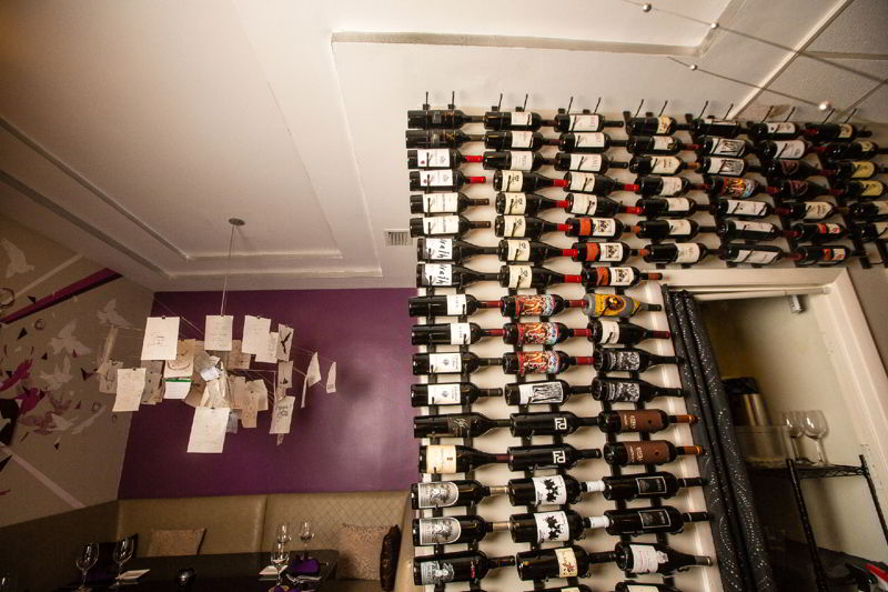 Interior of Twenty Twenty Grille with its wine wall and dining booths
